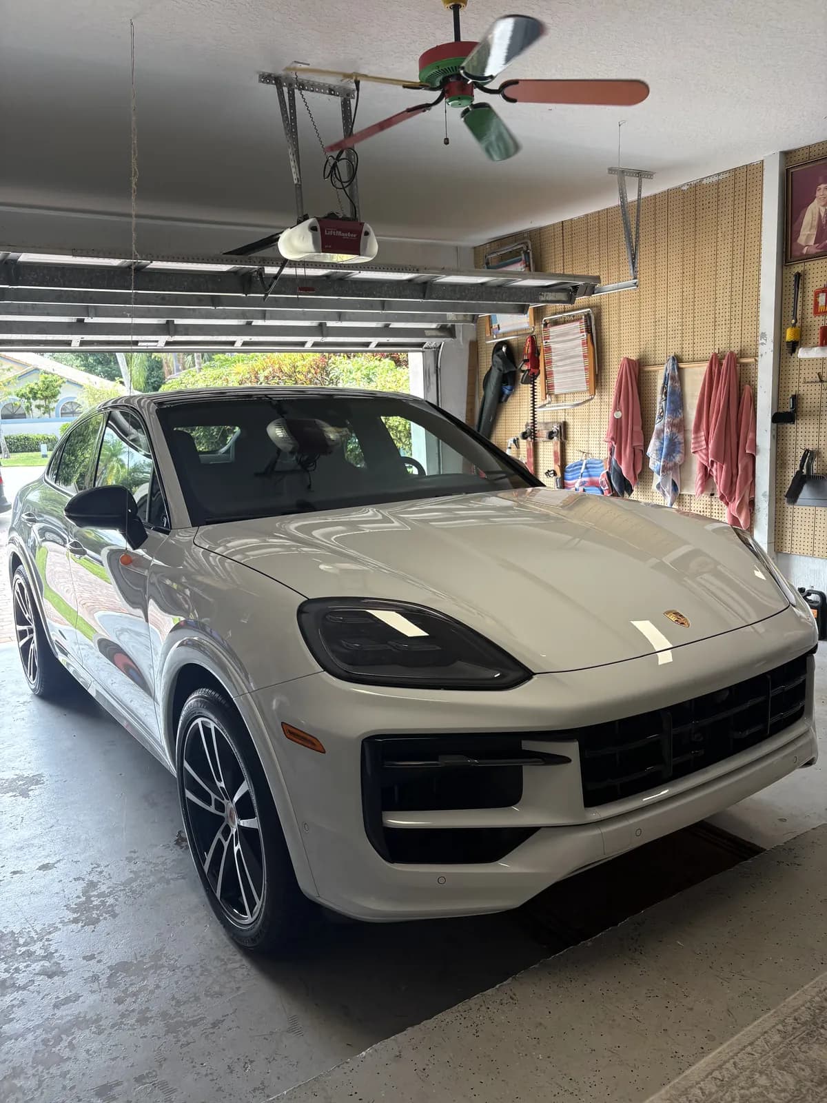 Porsche Cayenne detailed on location in a client's garage in Broward County